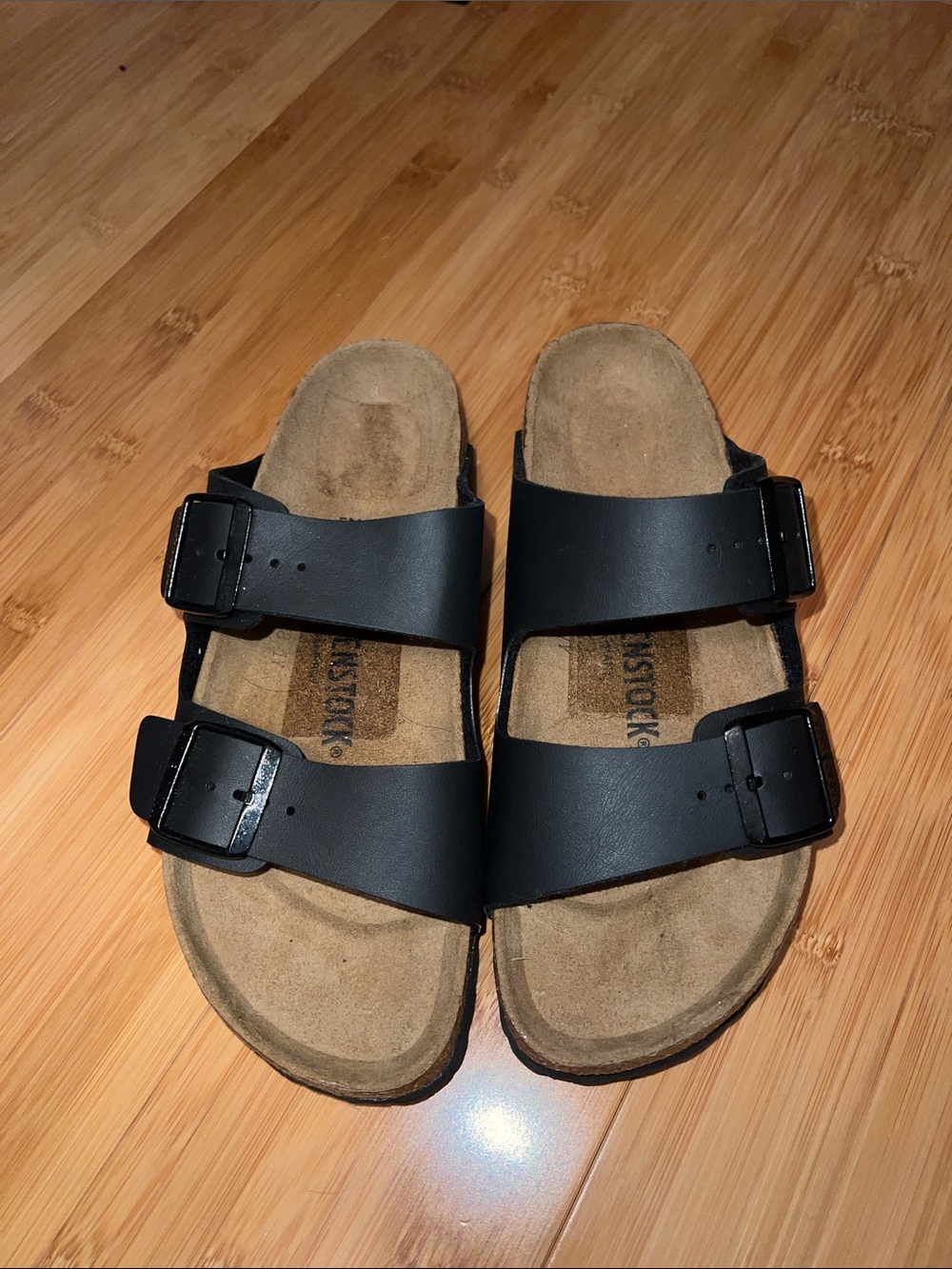 Birkenstock women’s  Arizona Sandals in Black with Brown Footbed